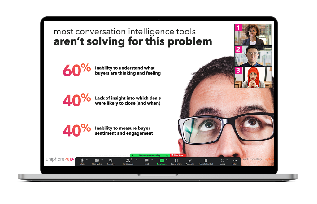 A presentation slide showing on a computer screen, with statistics and issues in sales engagement listed, viewed over the shoulder of a person with glasses.